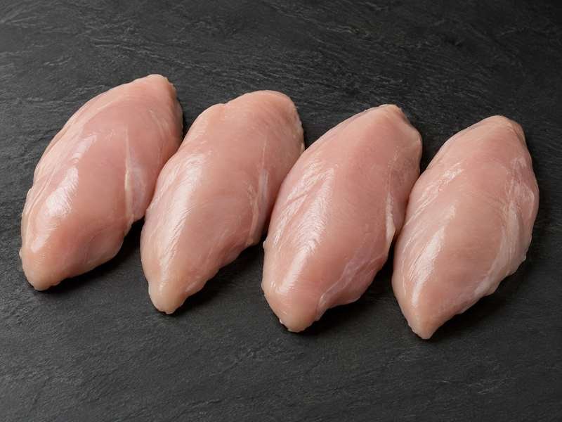Four raw skinless chicken breast fillets