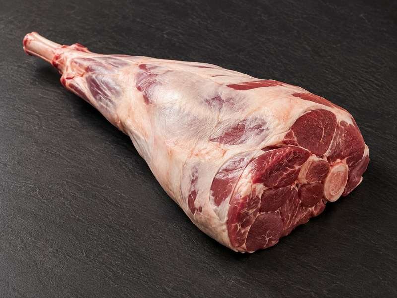 Whole raw bone-in leg of lamb