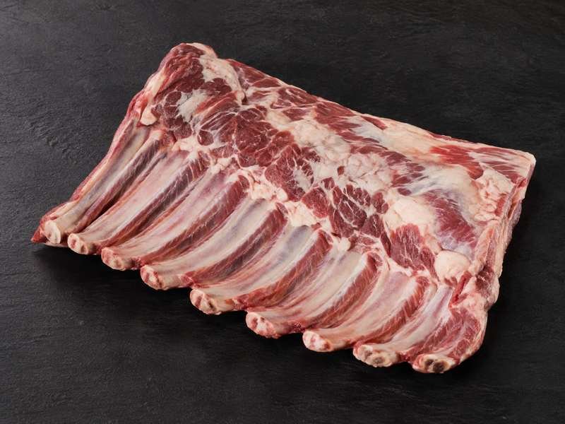 Raw sheet of lamb breast ribs